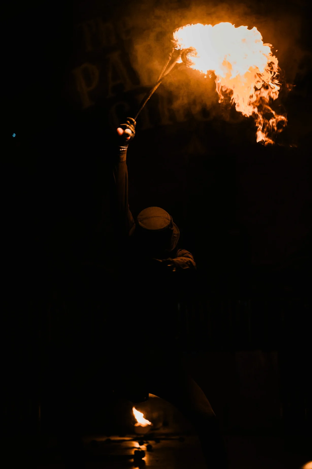 Fire performer surrounded by flame