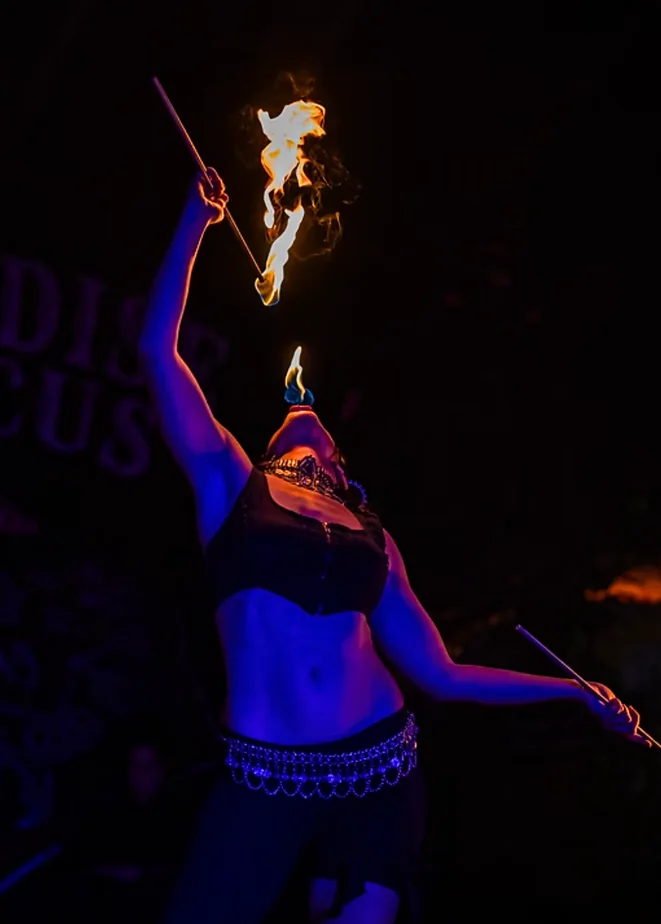 Fire performer holding a flame